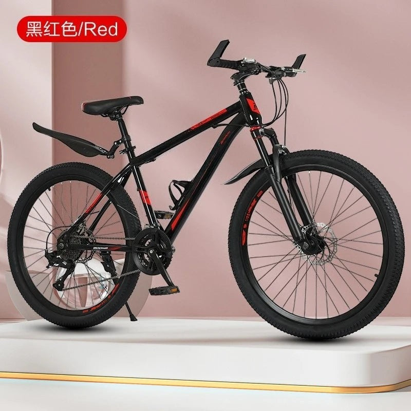 Bicicleta de montaña negra con detalles rojos, cuadro de acero, frenos de disco y suspensión delantera. Marca Variedad Online.