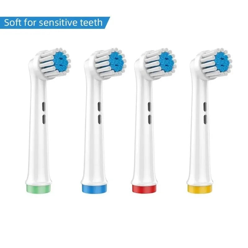 Cabezales de cepillo de dientes eléctricos de repuesto Variedad Online, suaves para dientes sensibles, con cerdas azules y anillos de colores en la base (verde, azul, rojo, amarillo).