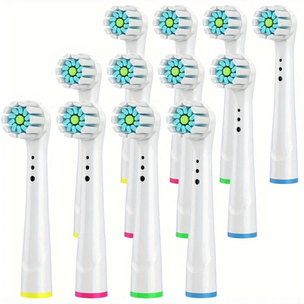 Variedad Online Cabezales de cepillo de dientes eléctricos de repuesto, blancos con cerdas azules y verdes, anillos de colores en la base.
