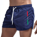 Bañadores azul marino de Variedad Online para hombre, con cordón blanco, cintura elástica y detalle de la bandera italiana en el lateral.