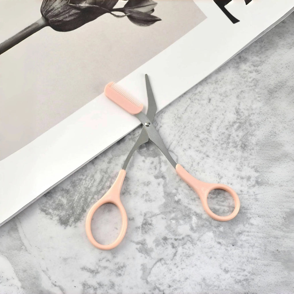Variedad Online tijeras para cejas rosas con peine integrado para dar forma y recortar con precisión.